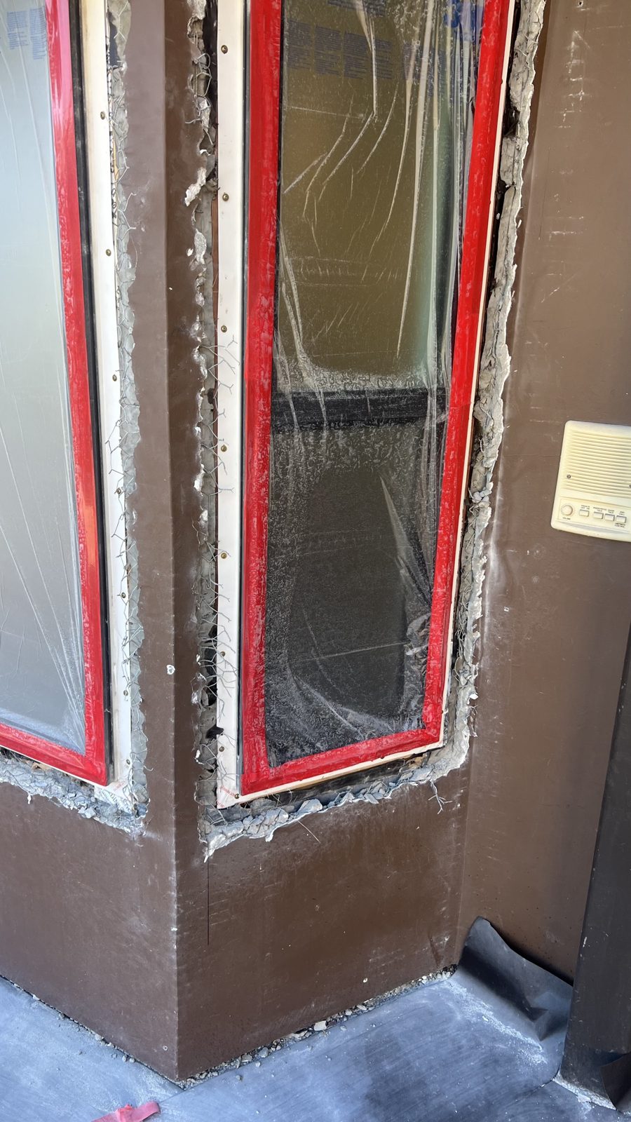 Window trim masked off before stucco